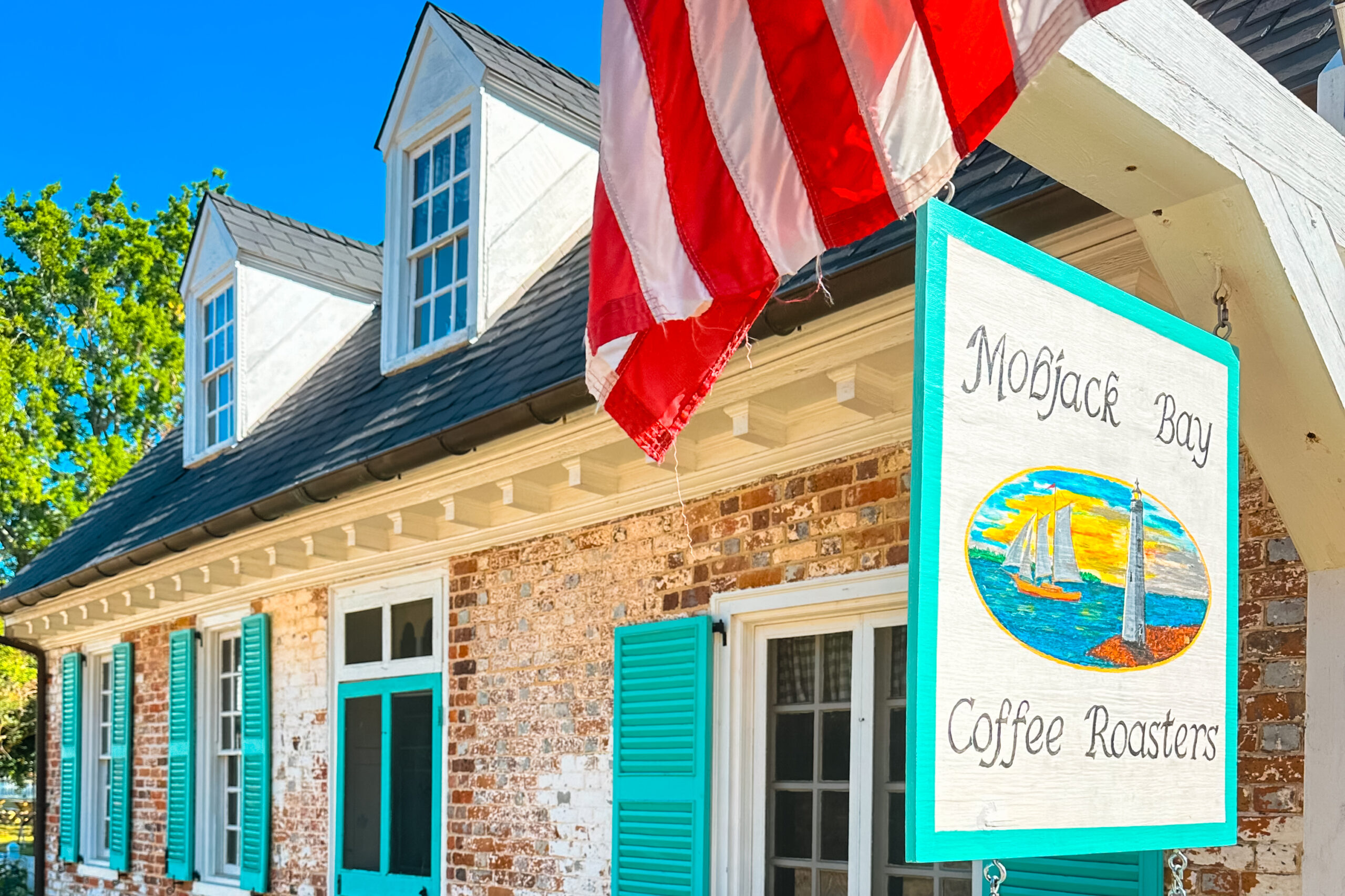 Visitors enjoying coffee and baked goods at Mobjack Bay Coffee Roasters in the historic Cole Digges House, Yorktown, Virginia.